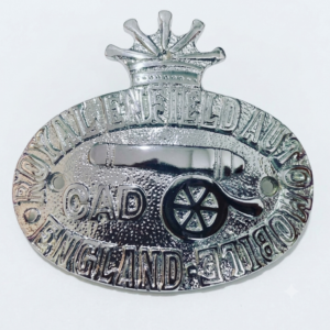 Premium chrome-finished Royal Enfield emblem badge for motorcycles, featuring reflective polished surface and classic branding, isolated on a plain white background