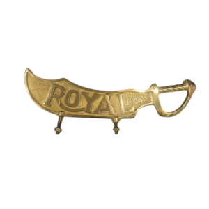SSM MOTO premium brass sword-style "ROYAL" emblem badge for motorcycle customization.